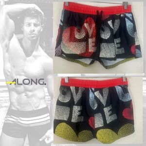 Along Swim Trunks 30-36" waist 1.5" inseam Polyester blend Gently worn No size